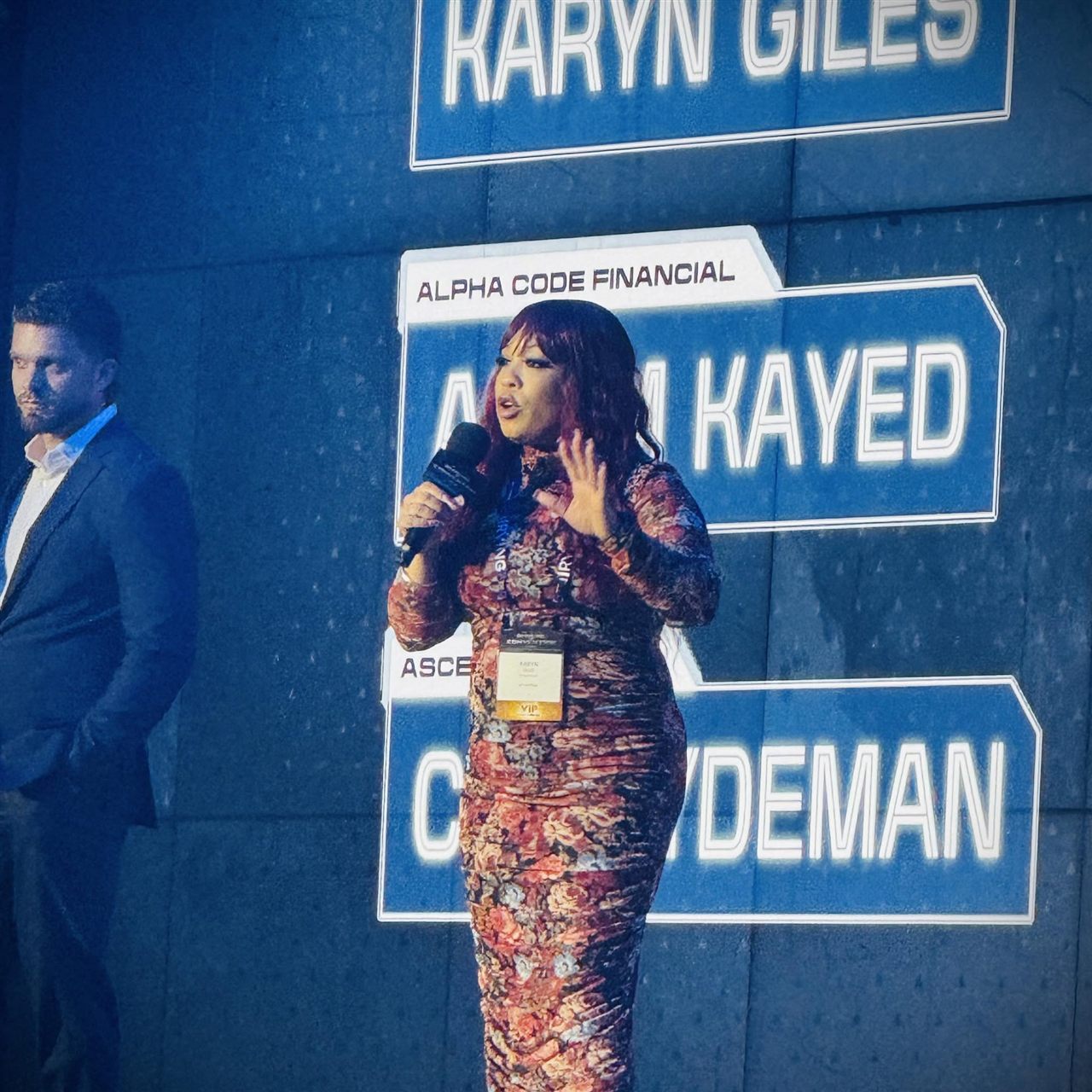 Karyn speaking on stage